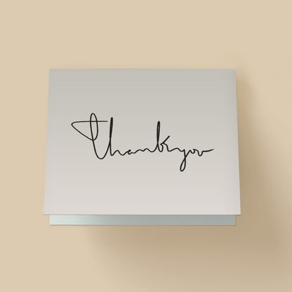 Thank you card with a white background. The words 'thank you' are written in thin, black, continuous-line handwritten cursive across the center.