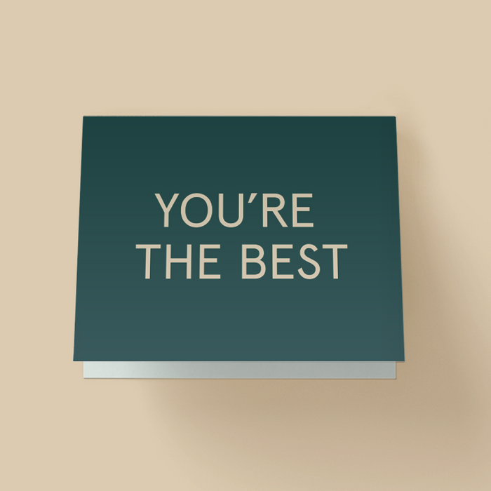 Minimalist appreciation card with a solid teal background. The words 'YOU'RE THE BEST' are printed in large, white, uppercase sans-serif letters centered on the card.
