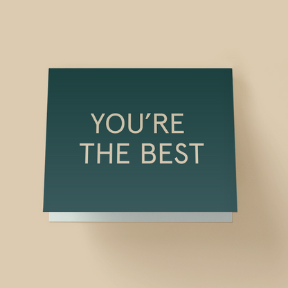 Minimalist appreciation card with a solid teal background. The words 'YOU'RE THE BEST' are printed in large, white, uppercase sans-serif letters centered on the card.